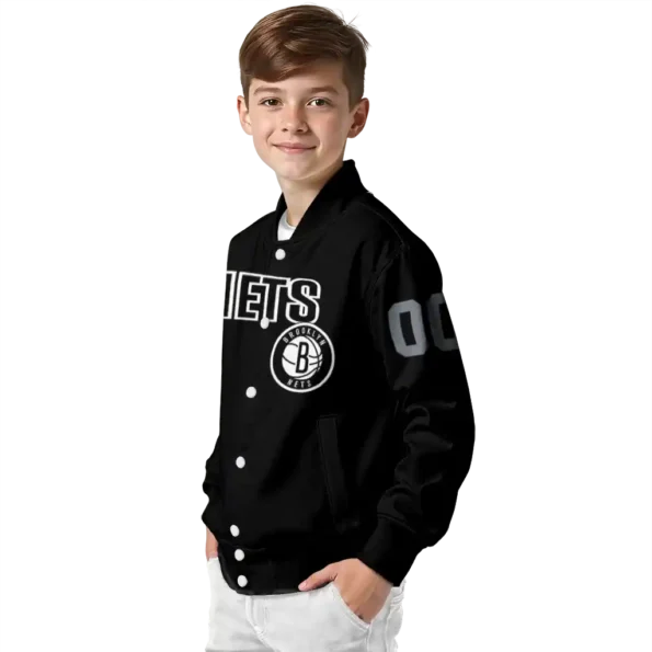 personalized brooklyn nets flame border black varsity jacket trendy.webp