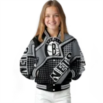 personalized brooklyn nets star burst black varsity jacket best selling.webp