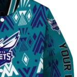personalized charlotte hornets pyramid shapes teal varsity jacket best selling.webp