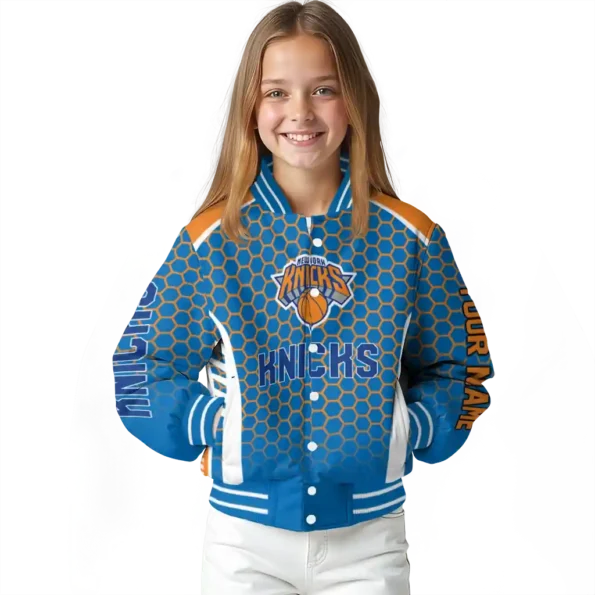 personalized new york knicks hexagon grid blue varsity jacket top rated.webp