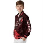 personalized portland trail blazers hexagon mesh red black varsity jacket best selling.webp